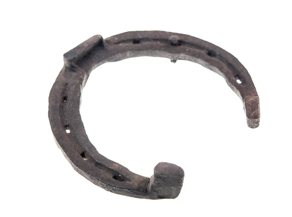 Rusty horseshoe with nail — Stock Photo, Image