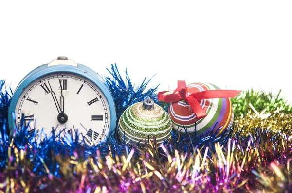 Christmas balls and alarm clock isolated on white — Stock Photo, Image