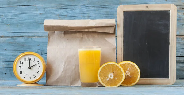 chalk board, and fresh orange juice in glasses