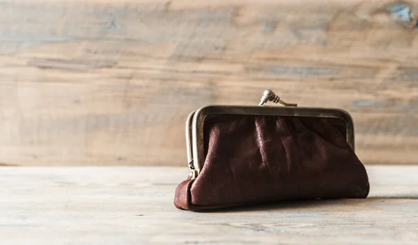 Vintage purse on wooden background. — Stock Photo, Image