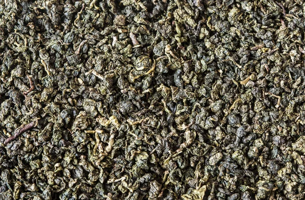干绿茶对木制背景 — 图库照片