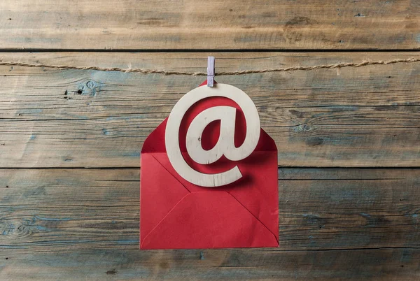 Wooden email symbol on grunge wood background — Stock Photo, Image