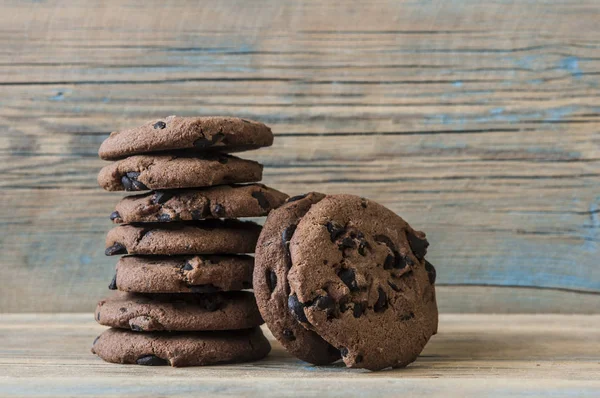 Chocolate cookies on wooden table — Stock Photo, Image
