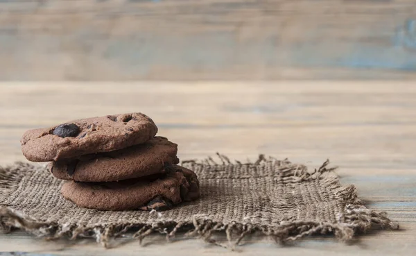 Chocolate cookies on wooden table — Stock Photo, Image