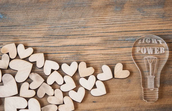 Icono de bombilla y forma de corazones — Foto de Stock