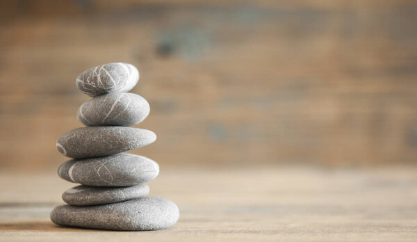 zen stones on wooden vintage table