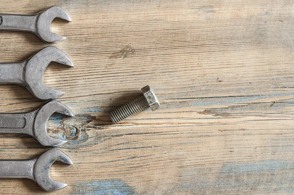 Wrenches on a wooden board — Stock Photo, Image