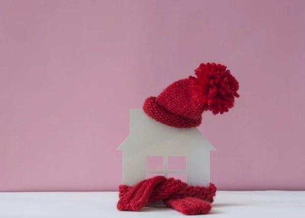 Close up conceptual miniature model house with red wool scarf ha — Stock Photo, Image