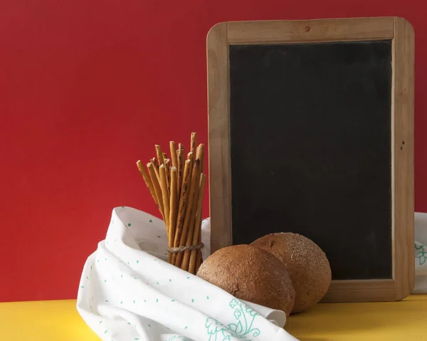 Wholewheat bread rolls and salted straw snack — Stock Photo, Image