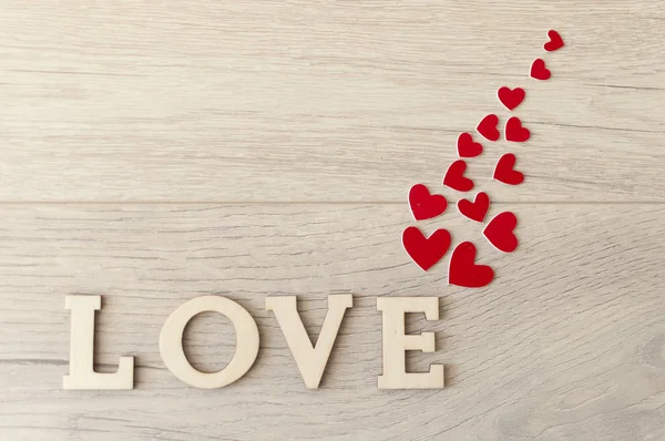 Word Love from wooden letters on a wood background — Stock Photo, Image