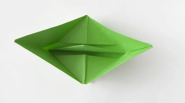 Green paper boat on white background — Stock Photo, Image