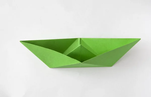 Green paper boat on white background — Stock Photo, Image