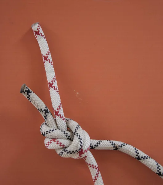 Knot on a rope for climbers. Mountaineering center.