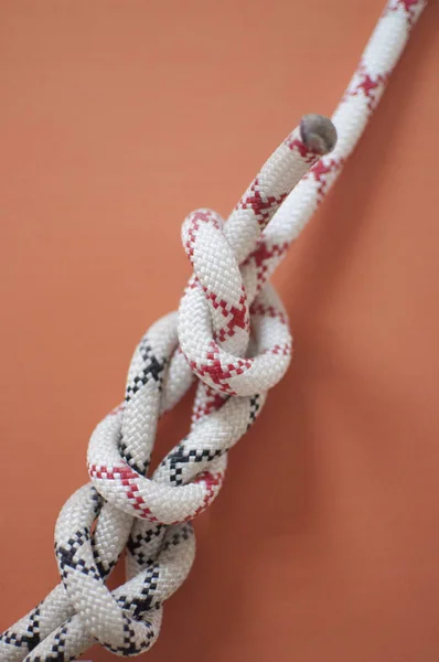 Knot on a rope for climbers. Mountaineering center.