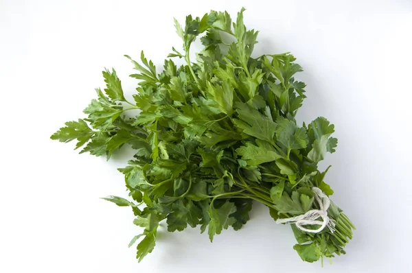 Bunch of parsley against a white background. Top view. Free spac — Stockfoto