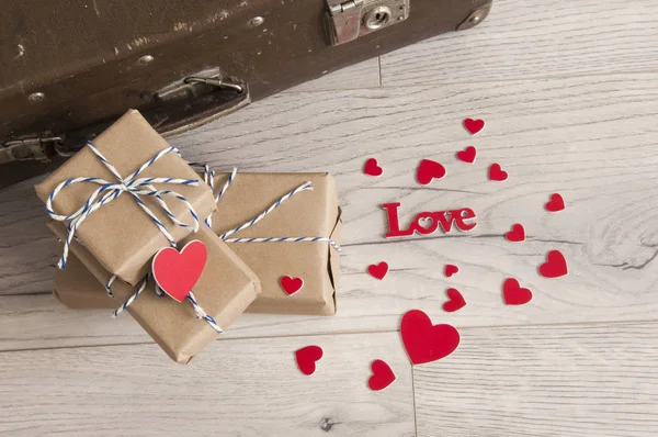 Valentine's Day background. Vintage suitcase with gift boxes and — 스톡 사진