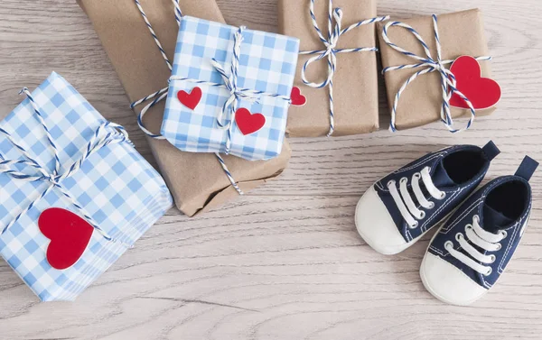 Greeting children card. Blue sneakers and gift boxeswith red hea — 스톡 사진