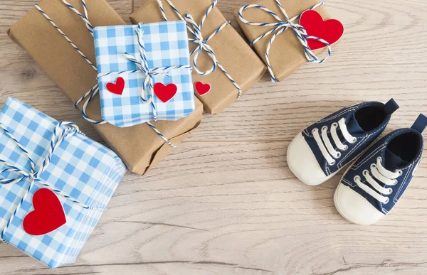 Greeting children card. Blue sneakers and gift boxeswith red hea — 스톡 사진