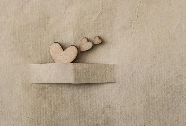 Old brown paper texture and heart decoration — Stock Photo, Image