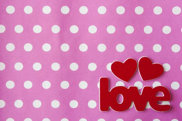 Word Love with red hearts on pink polka dot background. Greeting — Stock Photo, Image