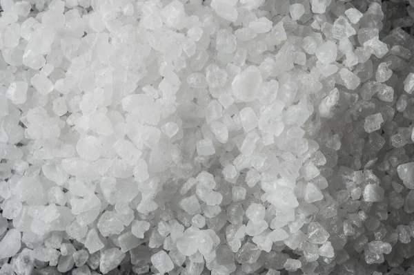 Sea salt on wooden background — Stock Photo, Image