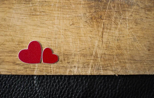 Valentine's Day card. Two red hearts on wooden background. Greet — 스톡 사진