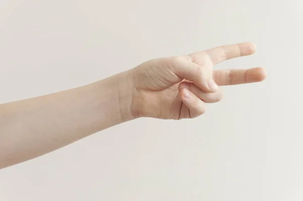 Hand barnet på den vita bakgrunden. — Stockfoto