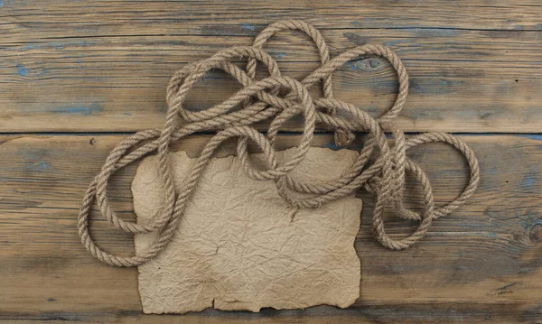 Old Sheet Parchment Paper Lying Wooden Boards Coarse Rope Pulled — Stock Photo, Image