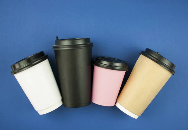 Four Disposable Coffee Cup Blue Background Top View Copy Space — Stock Photo, Image