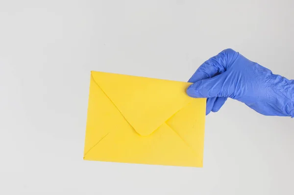 Hand Blue Medical Glove Holds Envelope White Background Contactless Delivery — Stock Photo, Image