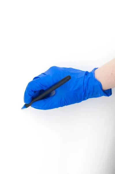 Female Hand Medical Glove Holds Pen Writes Air White Background — Stock Photo, Image