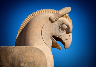 Homa or Huma Bird Figure against Dark Blue Sky in Persepolis Takhte Jamshid of Iran clipart