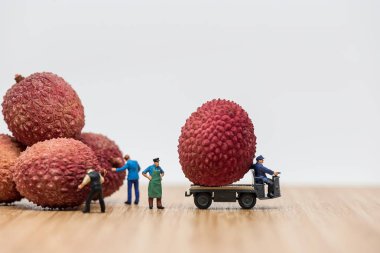 Lychees on truck. Delivery concept. clipart