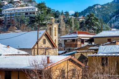 Mountain picturesque village of Kakopetria in a snowy day. Nicosia District, Cyprus. clipart