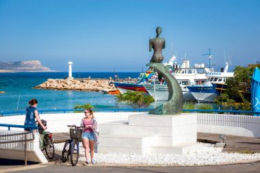 AYIA NAPA, CYPRUS - APRIL 21, 2017: A view of the main square towards sea clipart