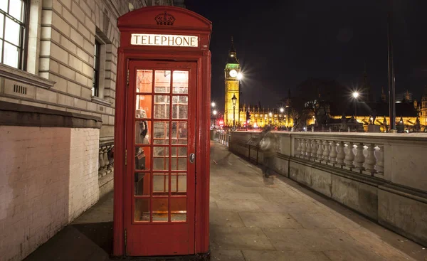 Red Telephone Booth at night, Big Ben in the distance, London, U