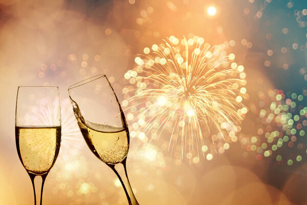 Champagne glasses on sparkling background