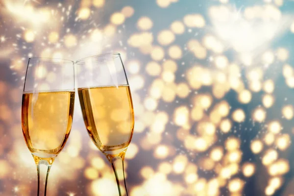 Champagne glasses on sparkling background — Stock Photo, Image