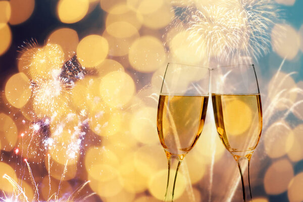 Champagne glasses on sparkling background