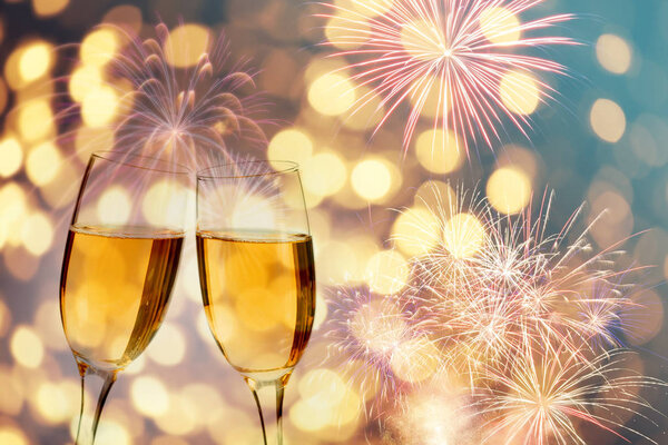 Champagne glasses on sparkling background