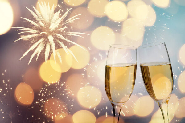 Champagne glasses on sparkling background