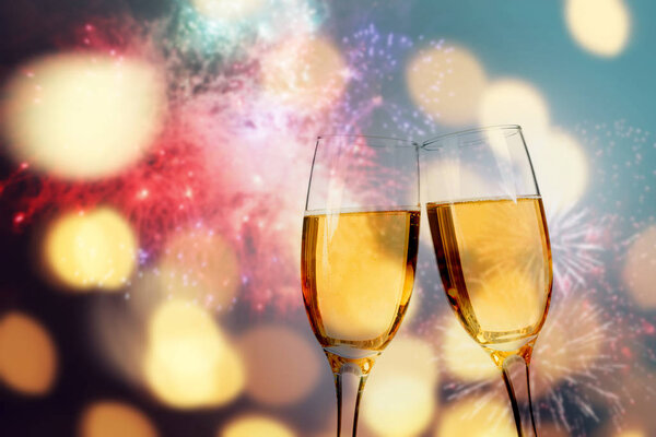 Champagne glasses on sparkling background