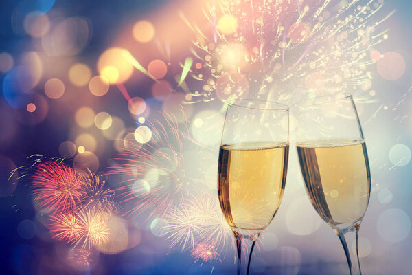 Champagne glasses on sparkling background