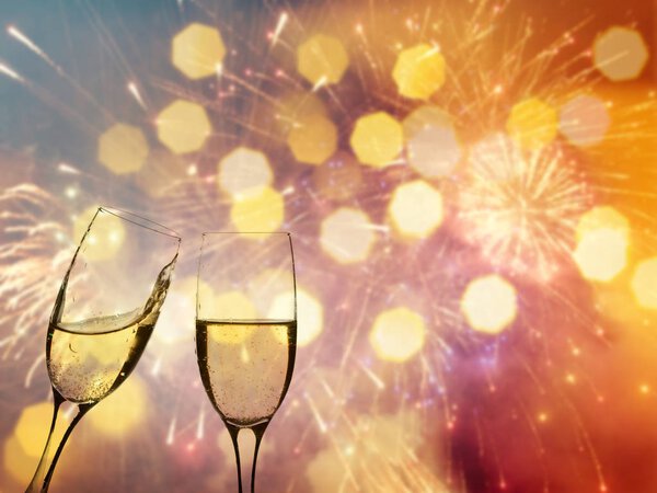 Champagne glasses on sparkling background