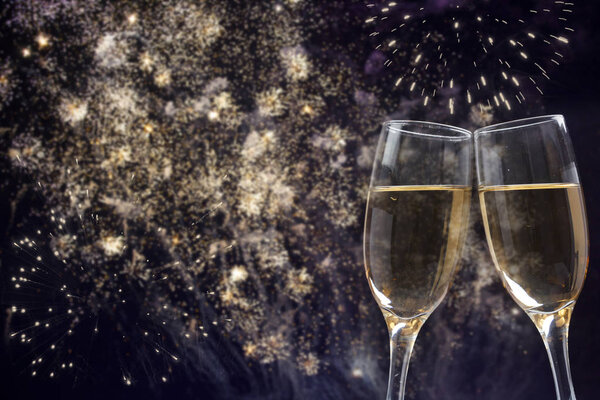 Champagne glasses on sparkling background