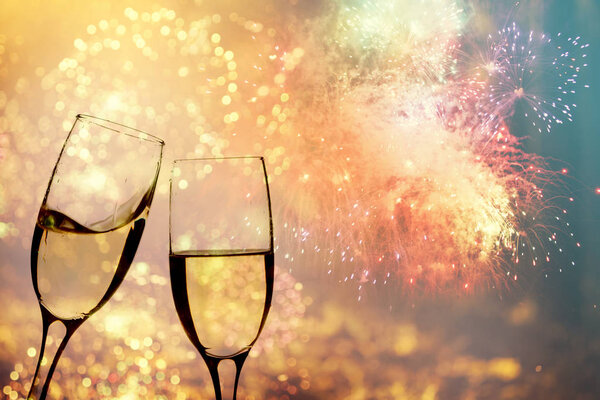 Champagne glasses on sparkling background