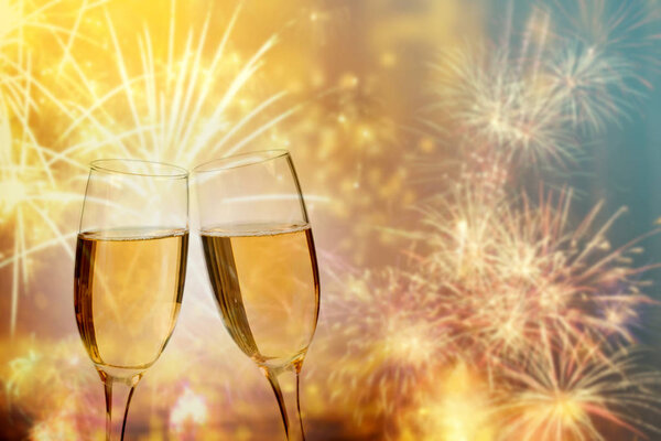 Champagne glasses on sparkling background