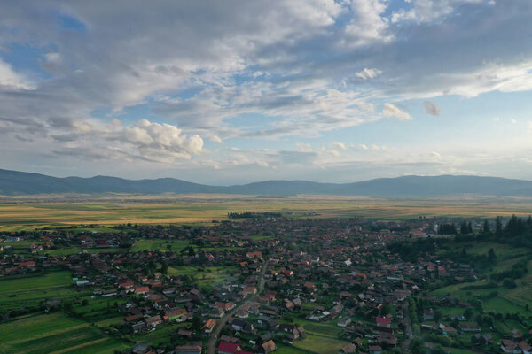 Aerial view of beautiful summer country landscape with dramatic sky in Transyilvania.