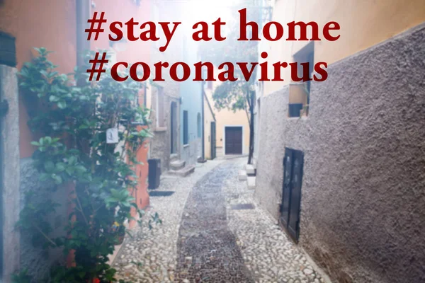 Staying at home with self quarantine to help slow outbreak and protect coronavirus spread.Italian village street with stay at home text.