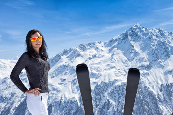 Beautiful brunette woman with ski — Stock Photo, Image